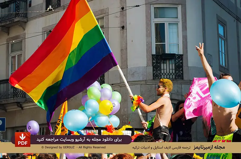 پسر گی با پرجم ال جی بی تی در جنبش همجنسگرایان